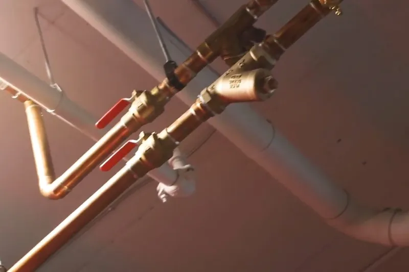 Commercial plumbing rough-in with exposed piping and drains for Moving valuables clear