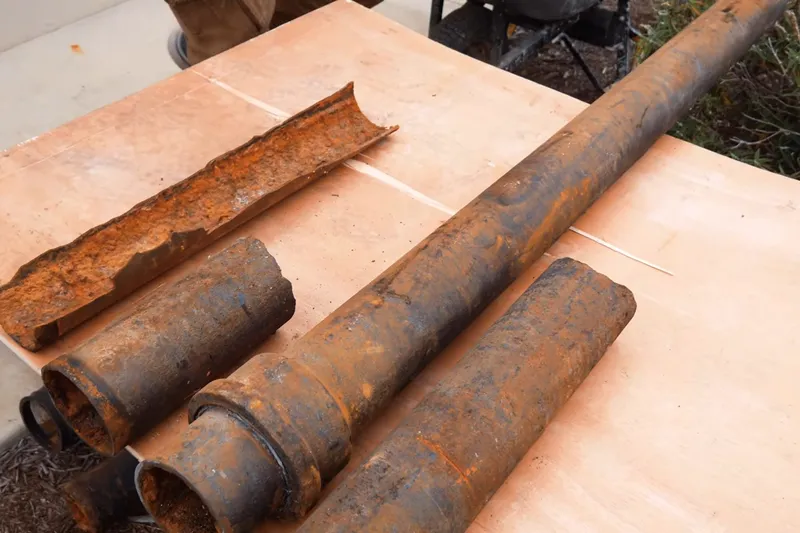 Corroded cast iron pipe section with rust buildup for 24/7 Emergency Plumber