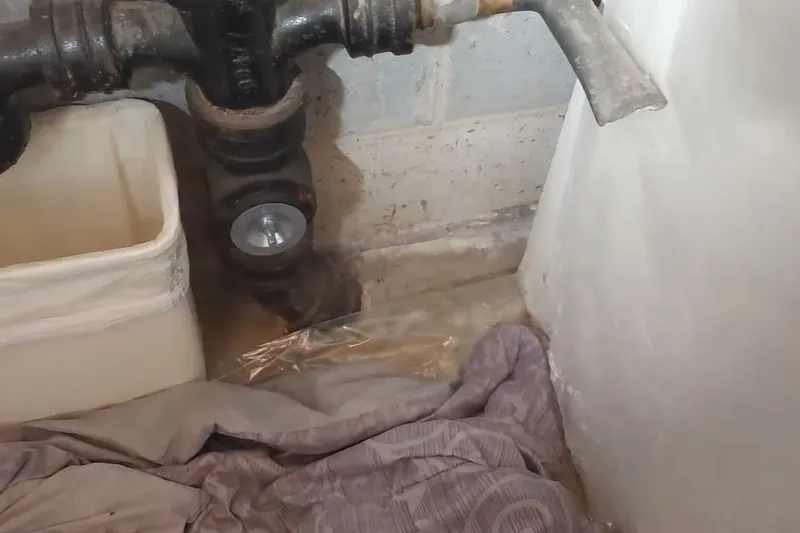 Corroded cast iron pipe section with rust buildup for Repiping & Whole-Home Pipe Replacement