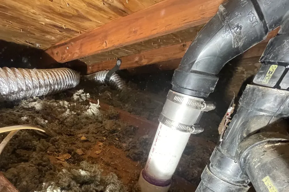 Crawl space plumbing pipe and drain connection for A vacant home ready for winter