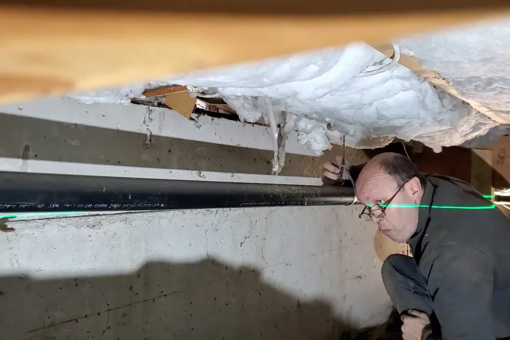 Drain cleanout and pipe connection being cleared for Plumber in Antelope Hills in Antelope Hills Area, Prescott, AZ