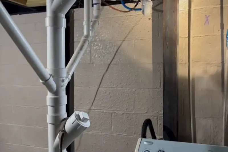 Exposed water service line with repair fittings installed for A PEX manifold