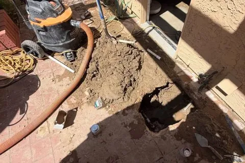 Opened concrete floor area for slab leak detection and repair for Spotting a slab leak early