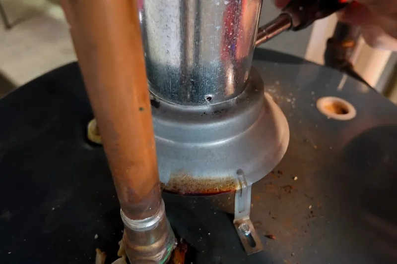Residential water heater with visible plumbing connections for Code-compliant venting in Prescott Valley, AZ