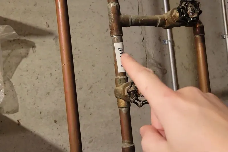 Residential water heater with visible plumbing connections for A Granville family home in Granville, Prescott Valley, AZ