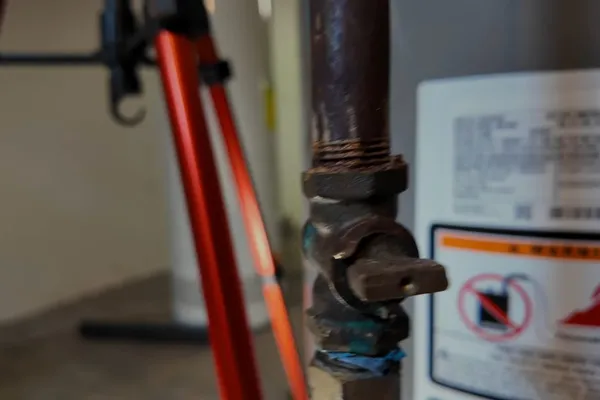 Residential water heater with visible plumbing connections for A tankless error code in Prescott Valley, AZ
