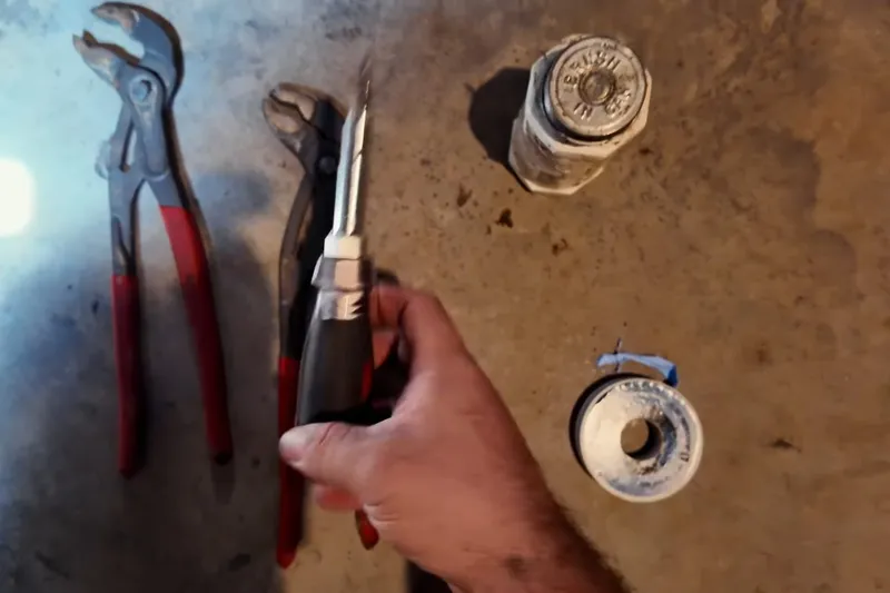 Residential water heater with visible plumbing connections for A water heater vacation setting