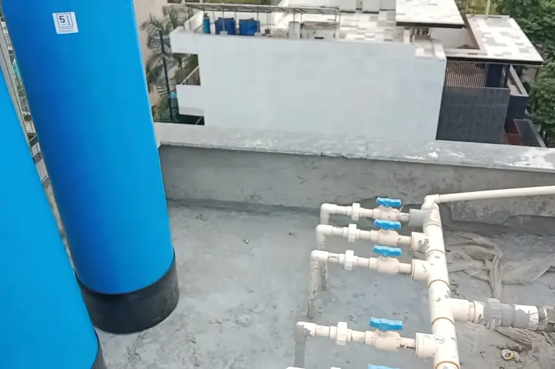 Residential water softener system with tank and plumbing connections for Hard-water sediment