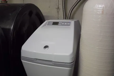 Residential water softener system with tank and plumbing connections for Year-round plumbing maintenance in Prescott Valley