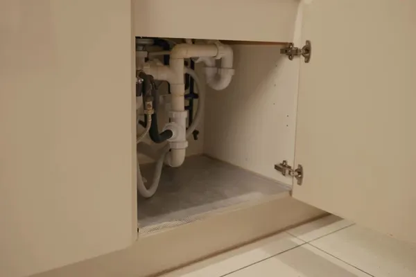 Sink faucet and under-sink drain connection being serviced for An anti-siphon vacuum breaker in Prescott Valley, AZ