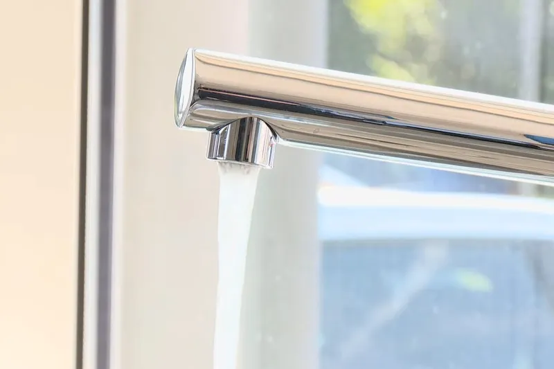 Sink faucet and under-sink drain connection being serviced for Hose Bib & Outdoor Faucet Repair