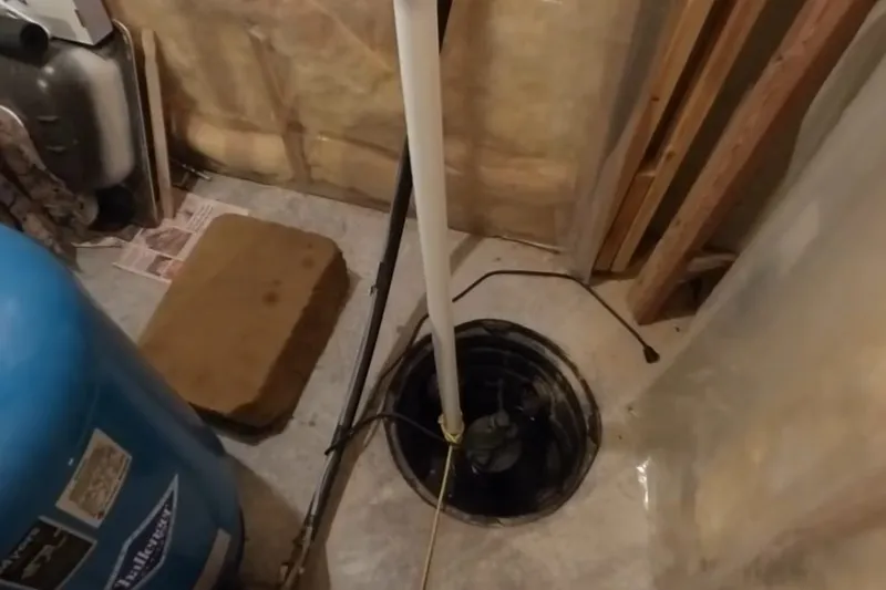 Sump pump and discharge pipe installed in a utility area for An established subdivision home in Mountain View Ranch, Prescott Valley, AZ