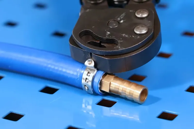 Plumbing repair tool positioned beside pipe fittings for Cottonwood