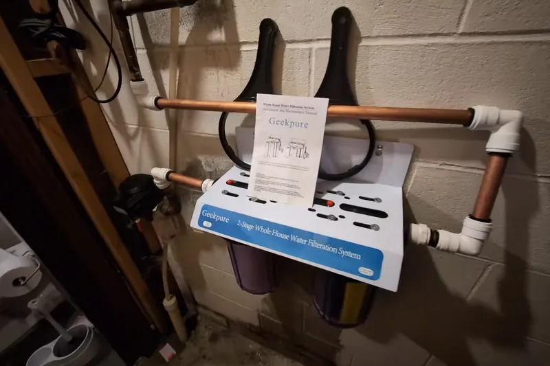 Water filtration system with filter housing and supply lines for Testing well water