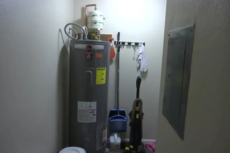 Water heater components being inspected by a technician for Testing the element and thermostat in Prescott Valley, AZ